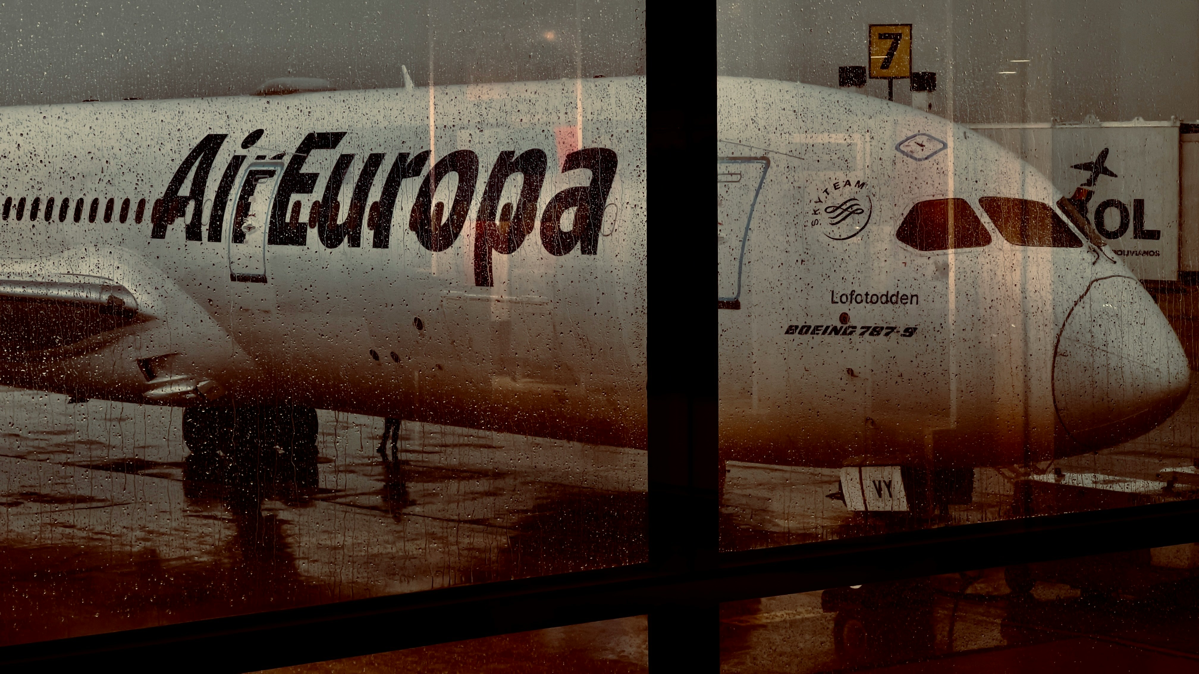 Air Europa airplane shot from rainy window